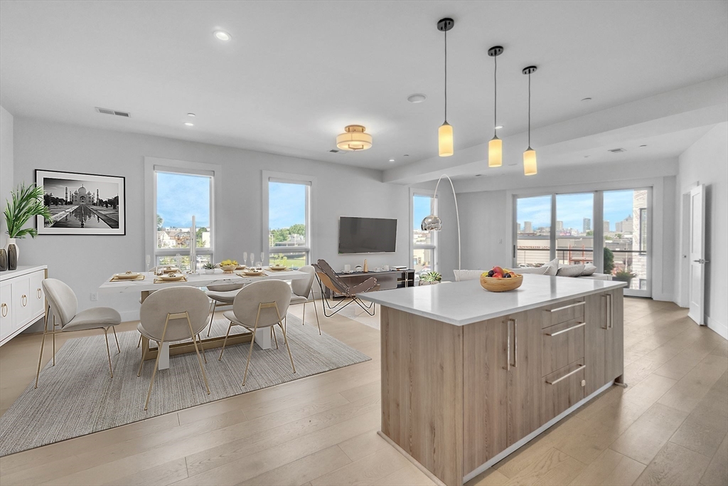 a view of living room kitchen with stainless steel appliances granite countertop living room and living room