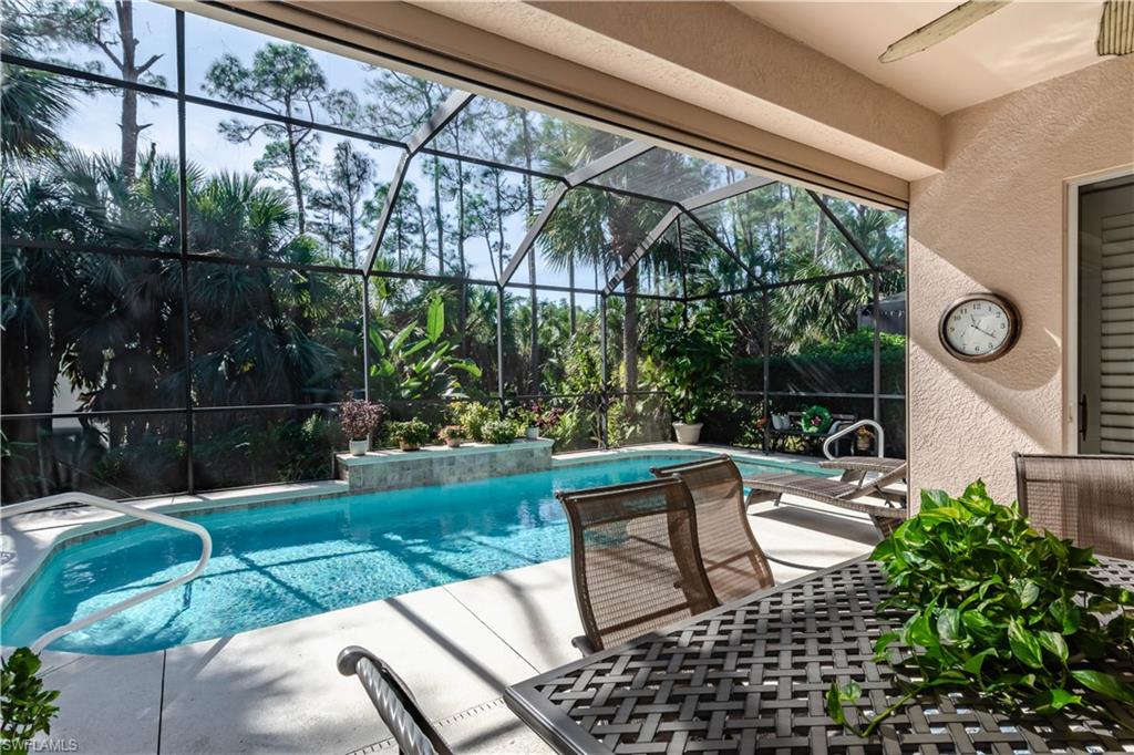 a view of backyard with seating area and green space