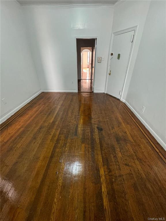 Living room with dark hardwood / wood-style floors