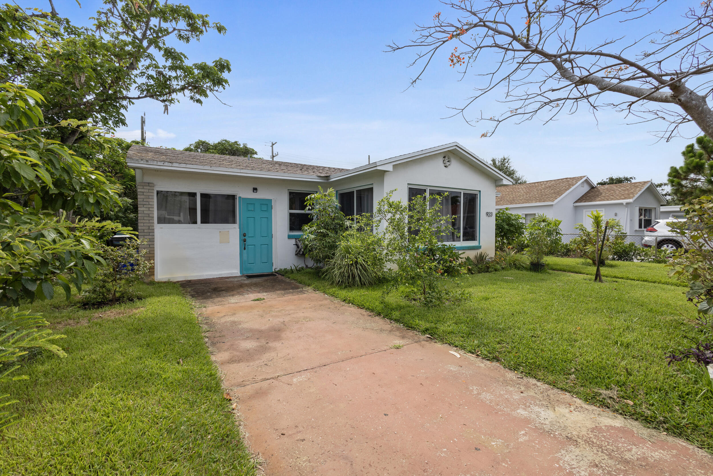 a front view of house with yard and green space