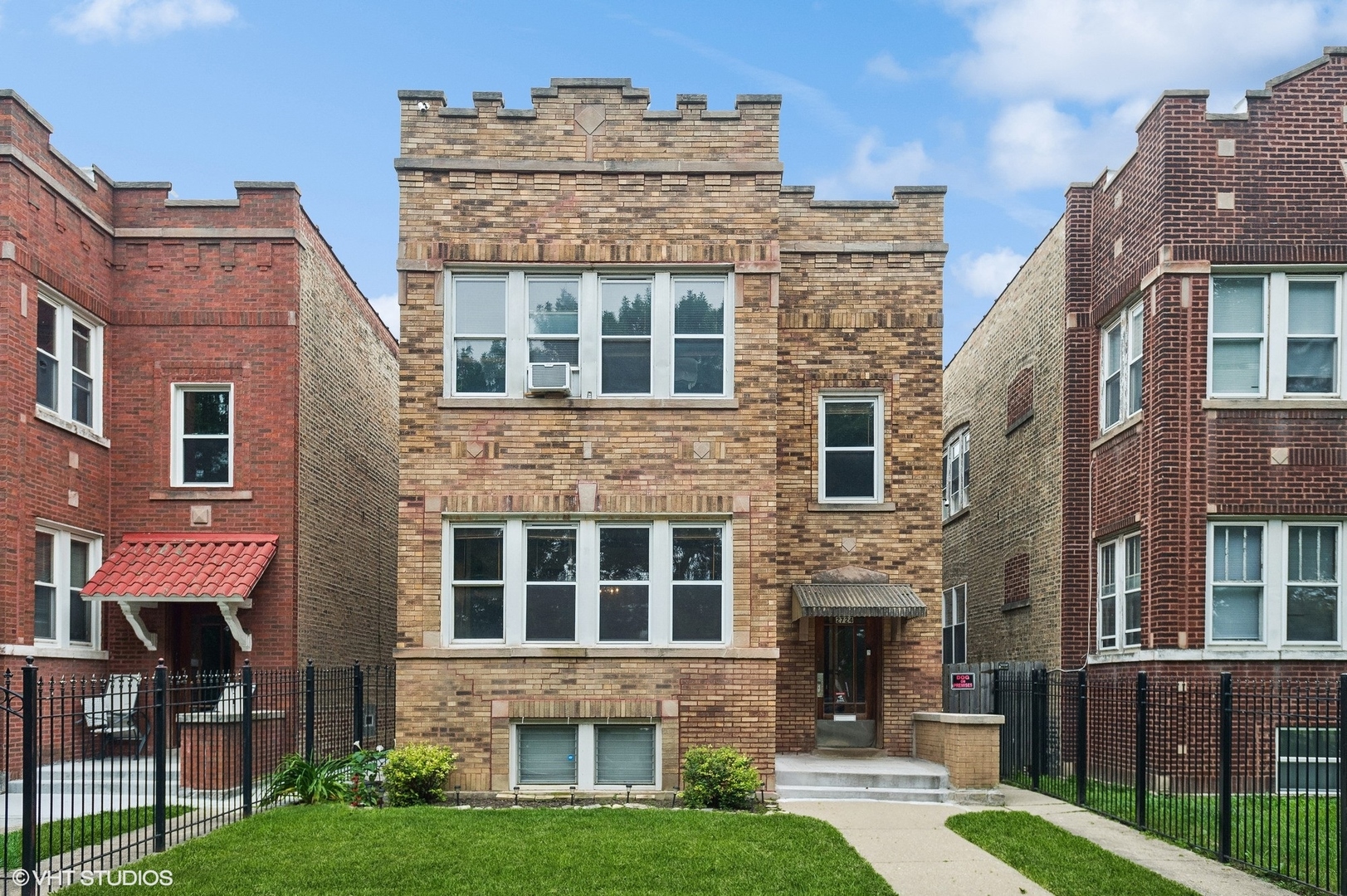 a view of a building with a yard