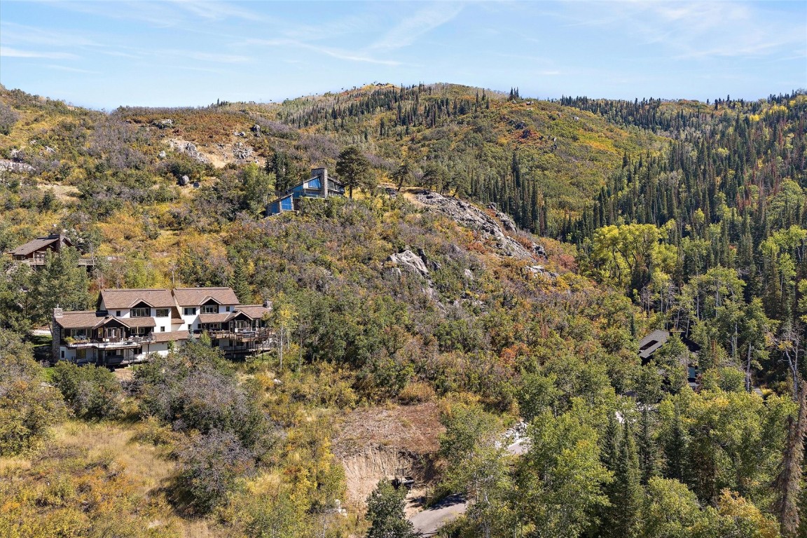 a view of a mountain with mountains in the background