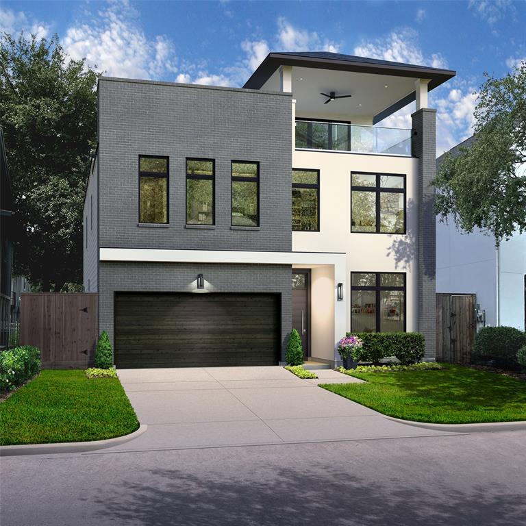 a front view of a house with a garden and garage