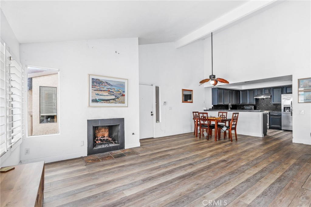 a view of a livingroom with furniture and a fireplace