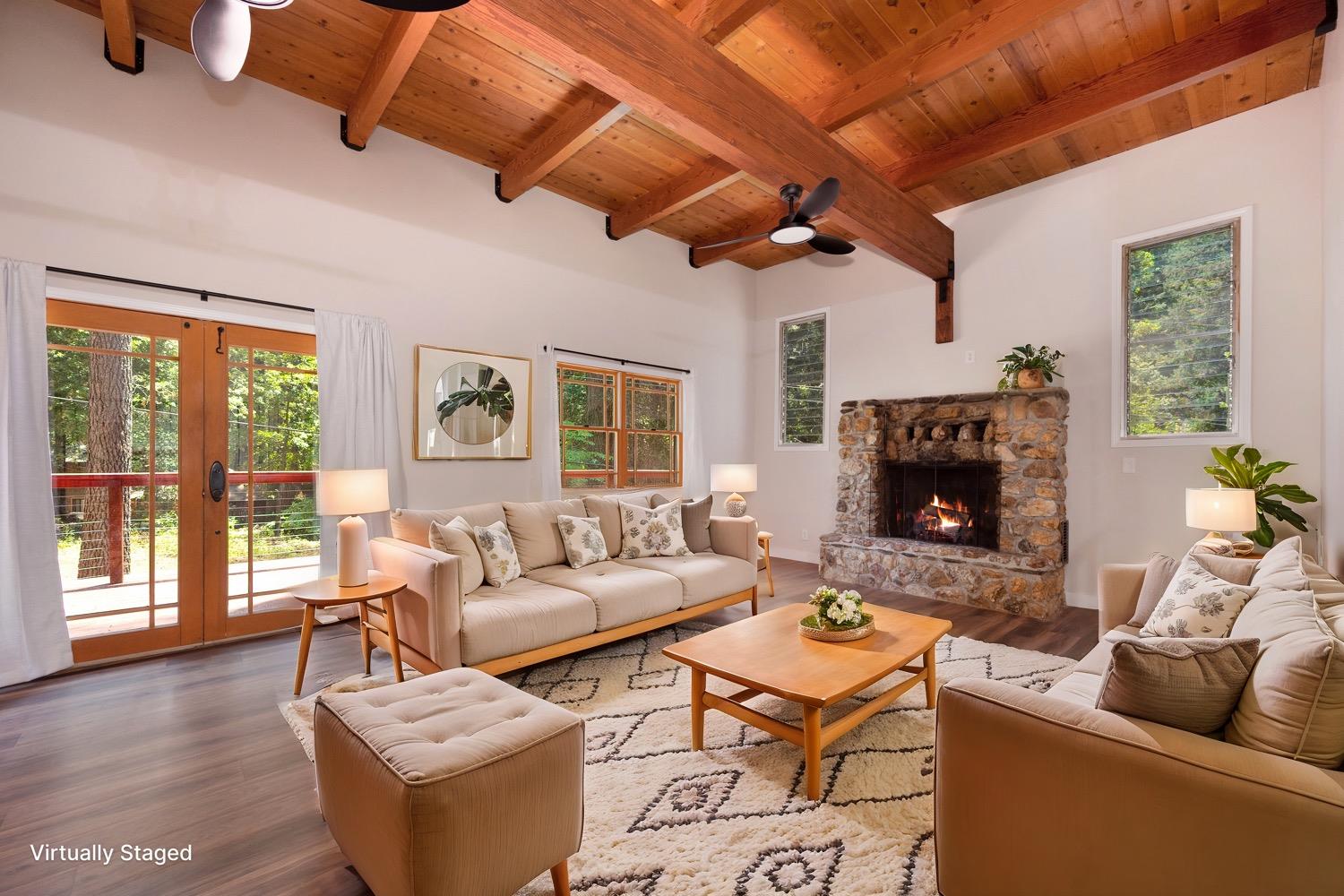 a living room with furniture a fireplace and a flat screen tv