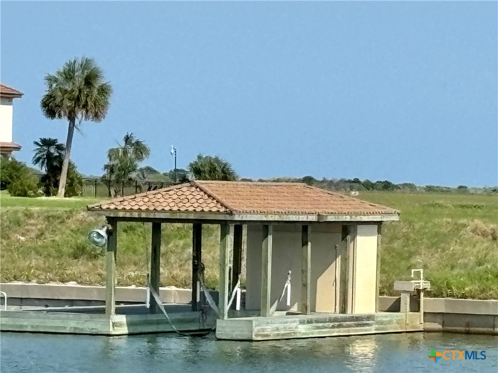 a view of a swimming pool with an outdoor seating