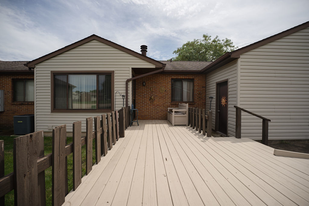 a view of a house on wooden deck