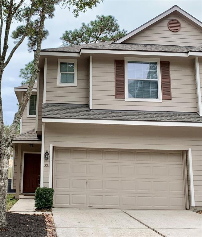 a front view of a house with garage