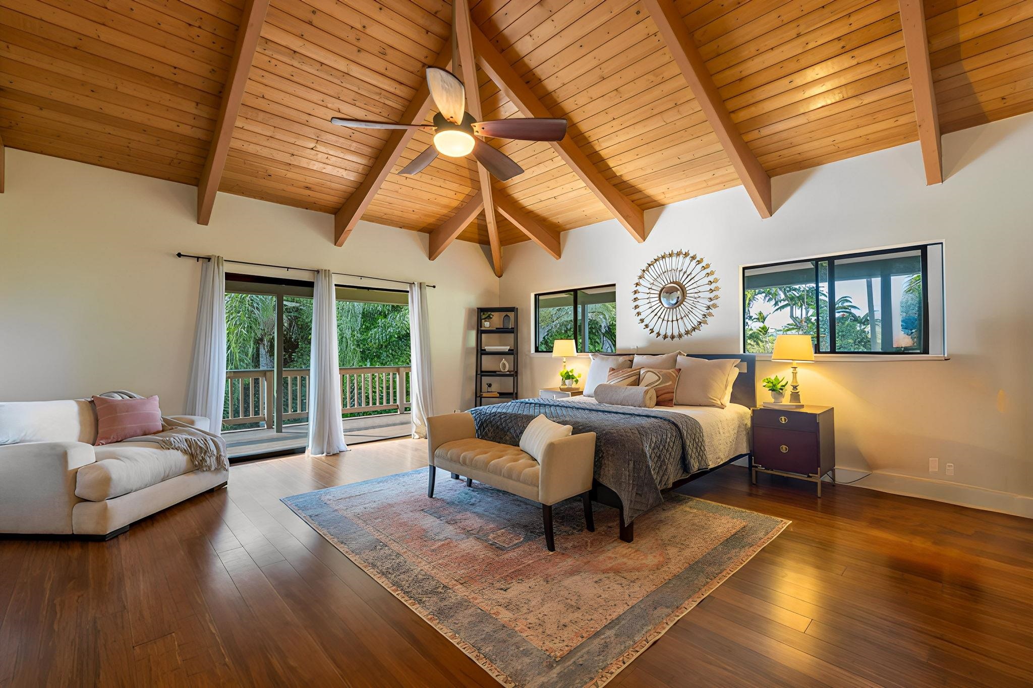 a spacious bedroom with a bed and wooden floors