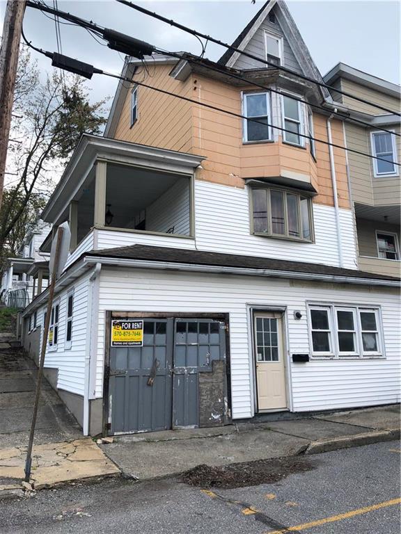 a view of a house with a garage