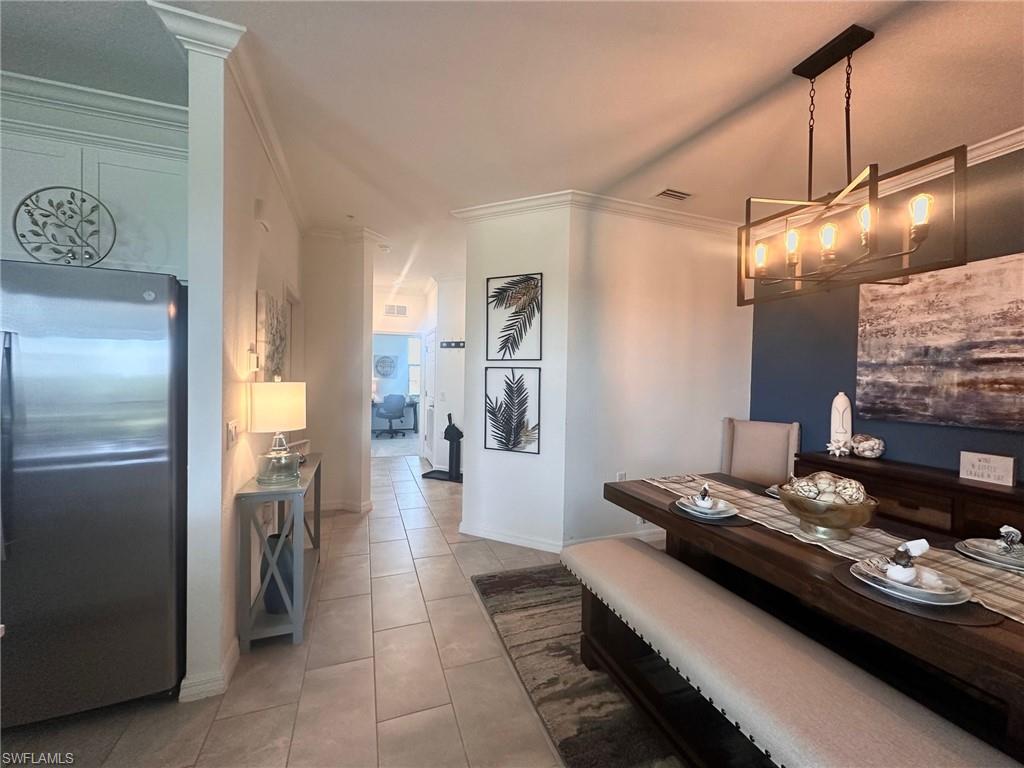 a kitchen with stainless steel appliances granite countertop a refrigerator and a stove