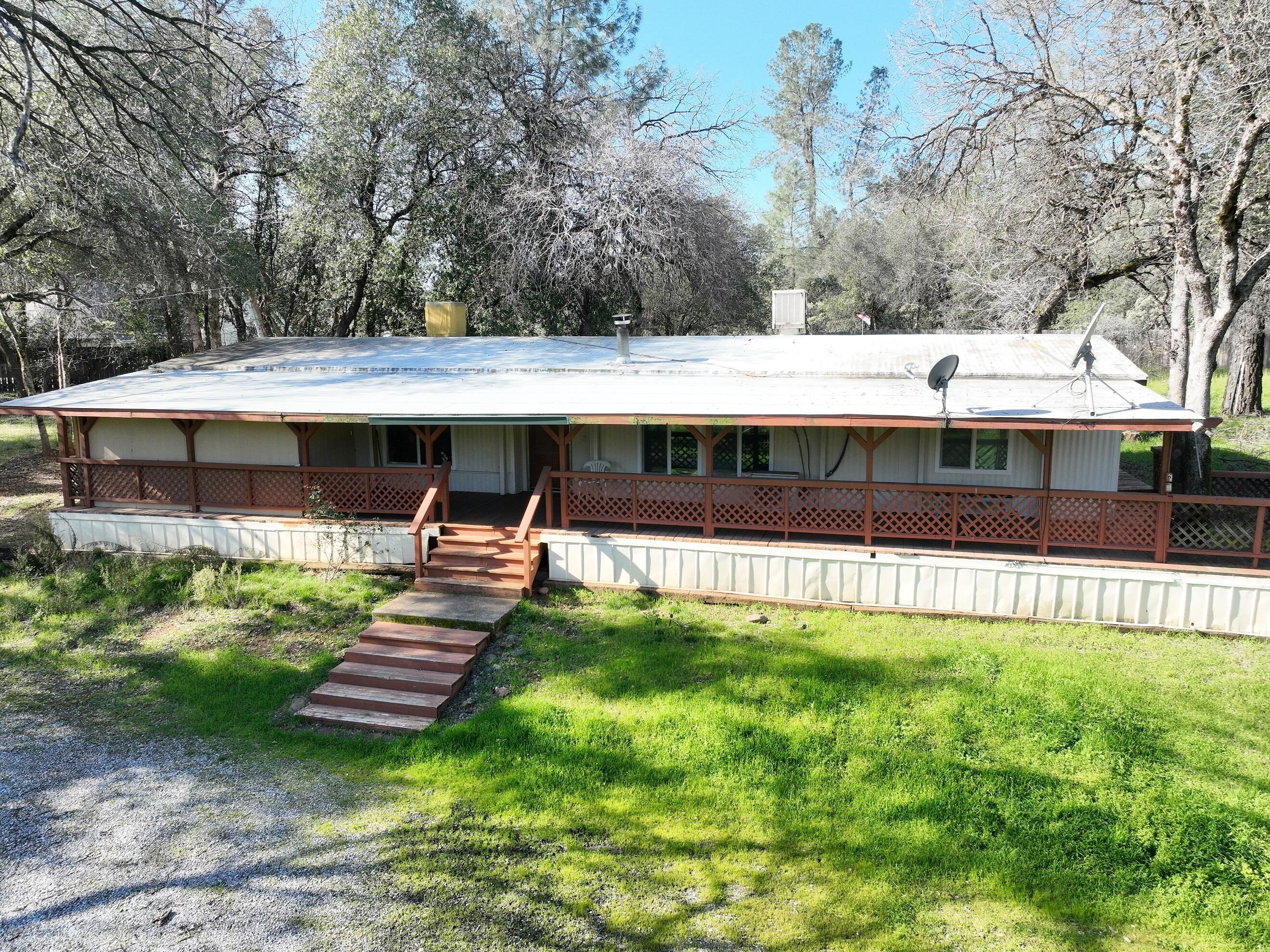 a view of a house with a big yard