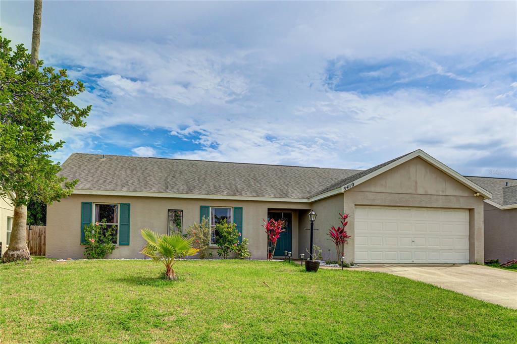 a front view of house with yard and outdoor seating