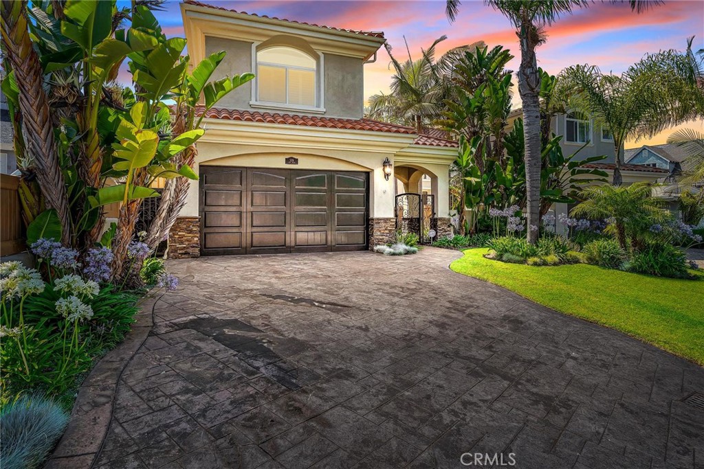 a view of a house with a yard and garage