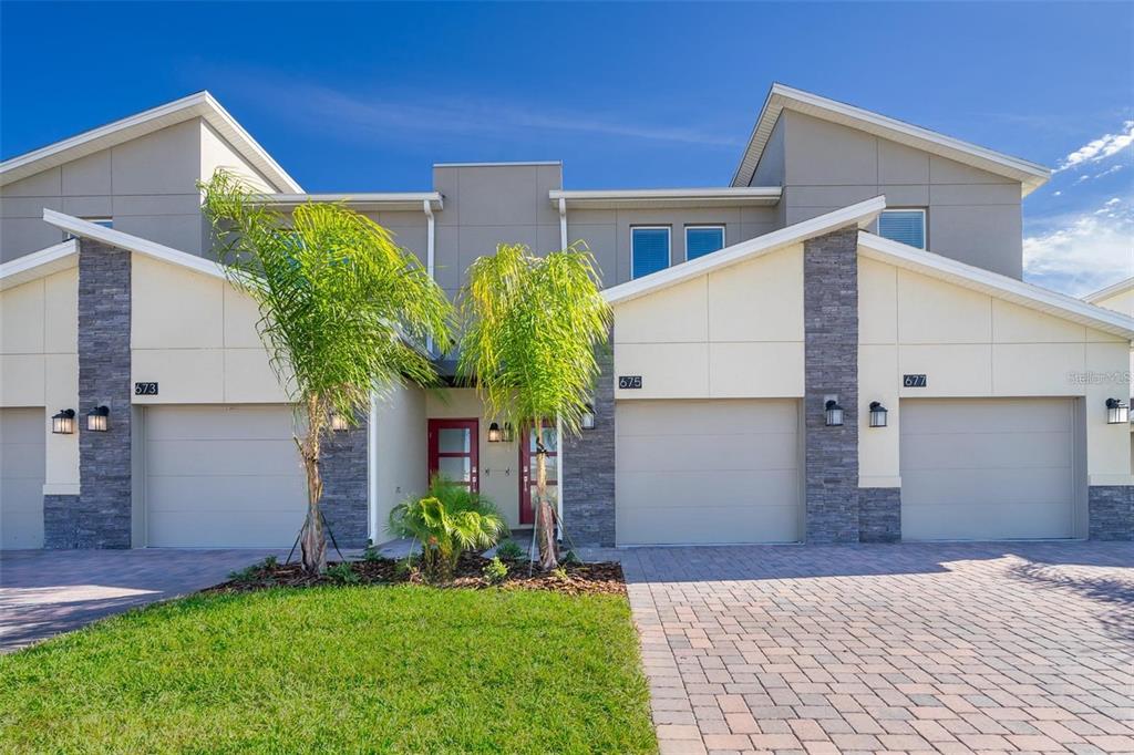 a house that has a tree in front of it