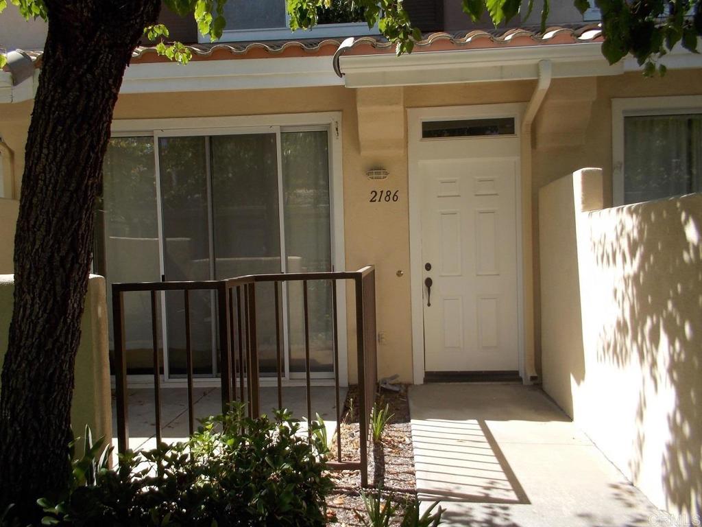 a view of a door and a window