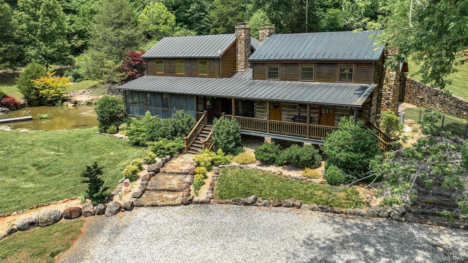 an aerial view of a house with a yard and potted plants