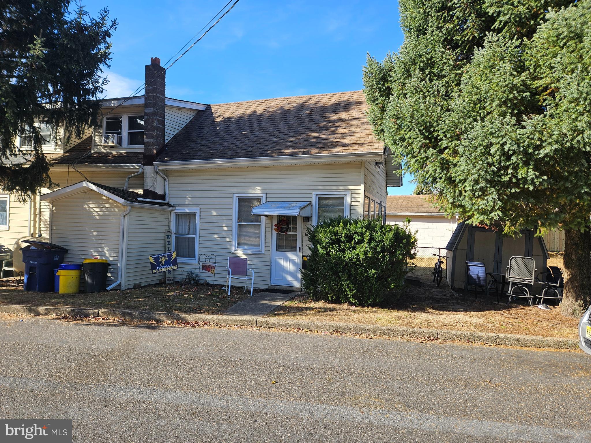 front view of a house with a street