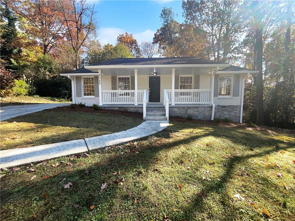 front view of a house with a yard