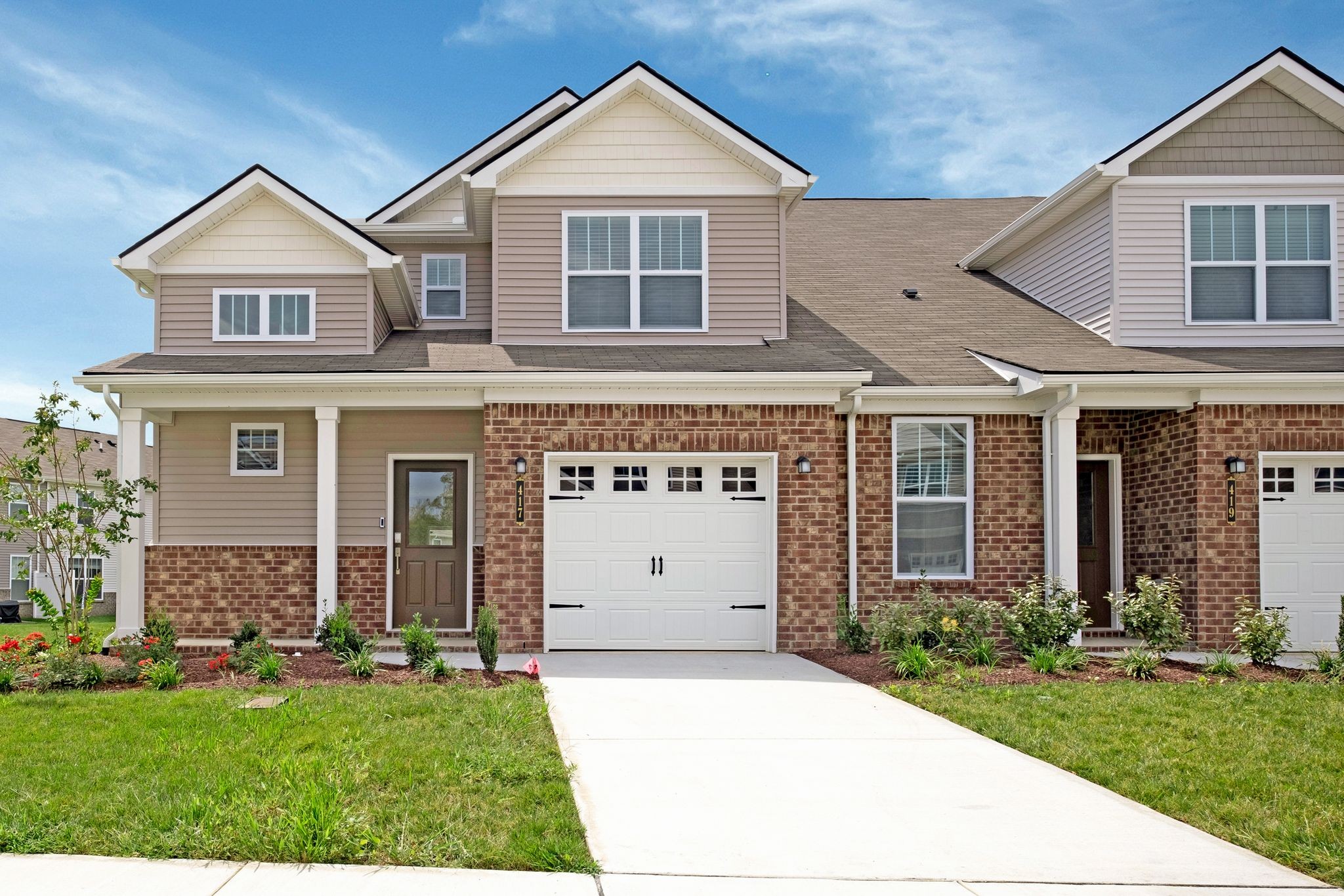 front view of a house with a yard