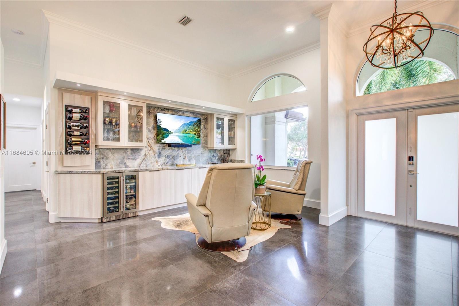 a living room with furniture window and wooden floor