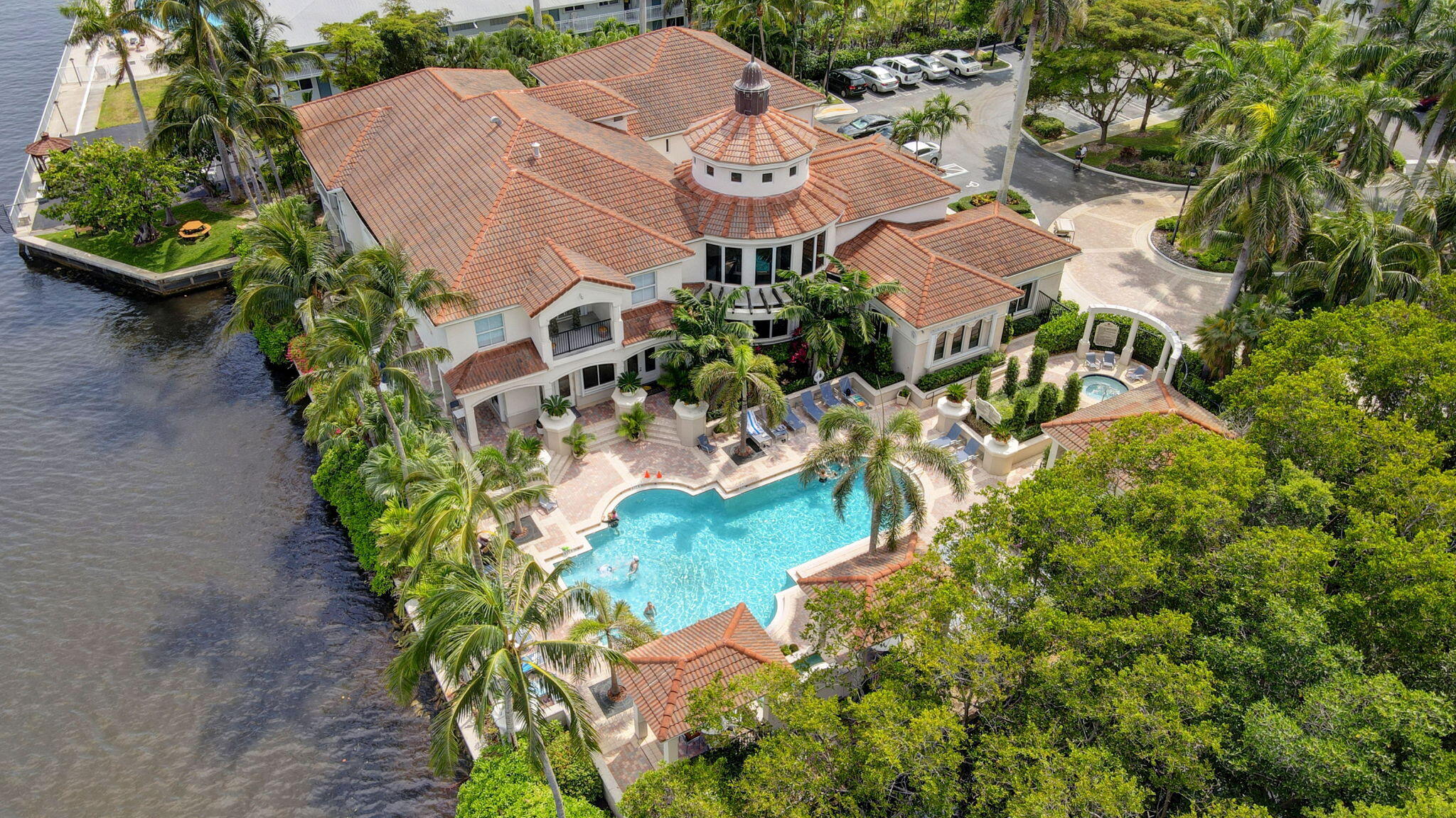 an aerial view of a house with a yard and garden