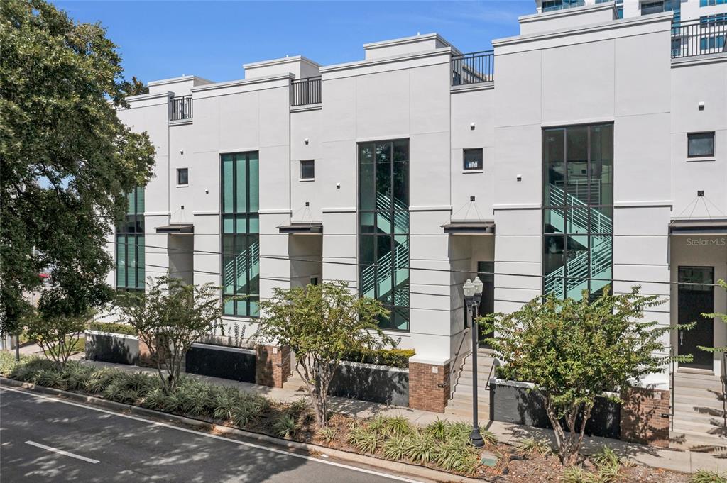 a front view of a house with outdoor seating