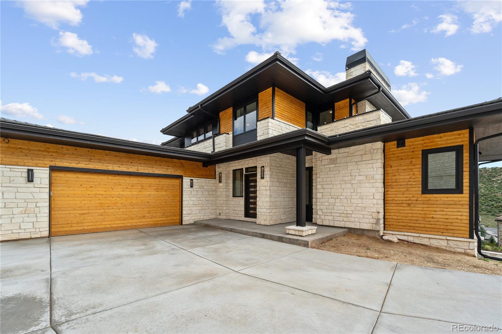 a front view of a house with a garage