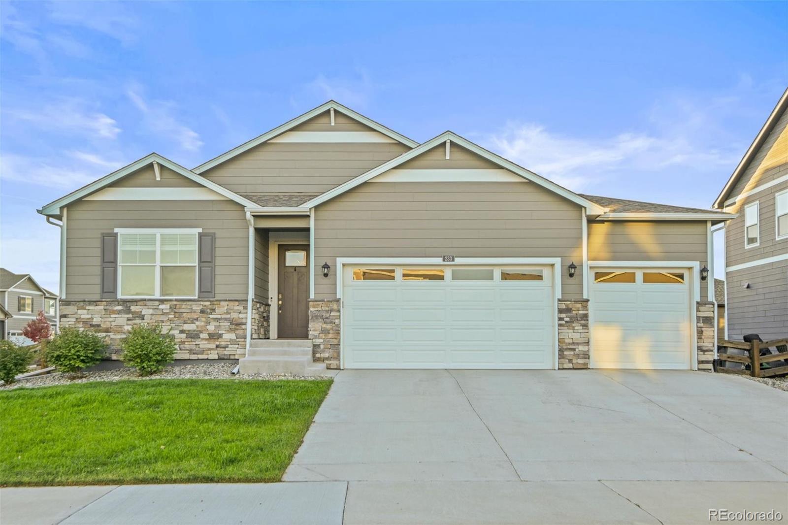 front view of a house with a yard