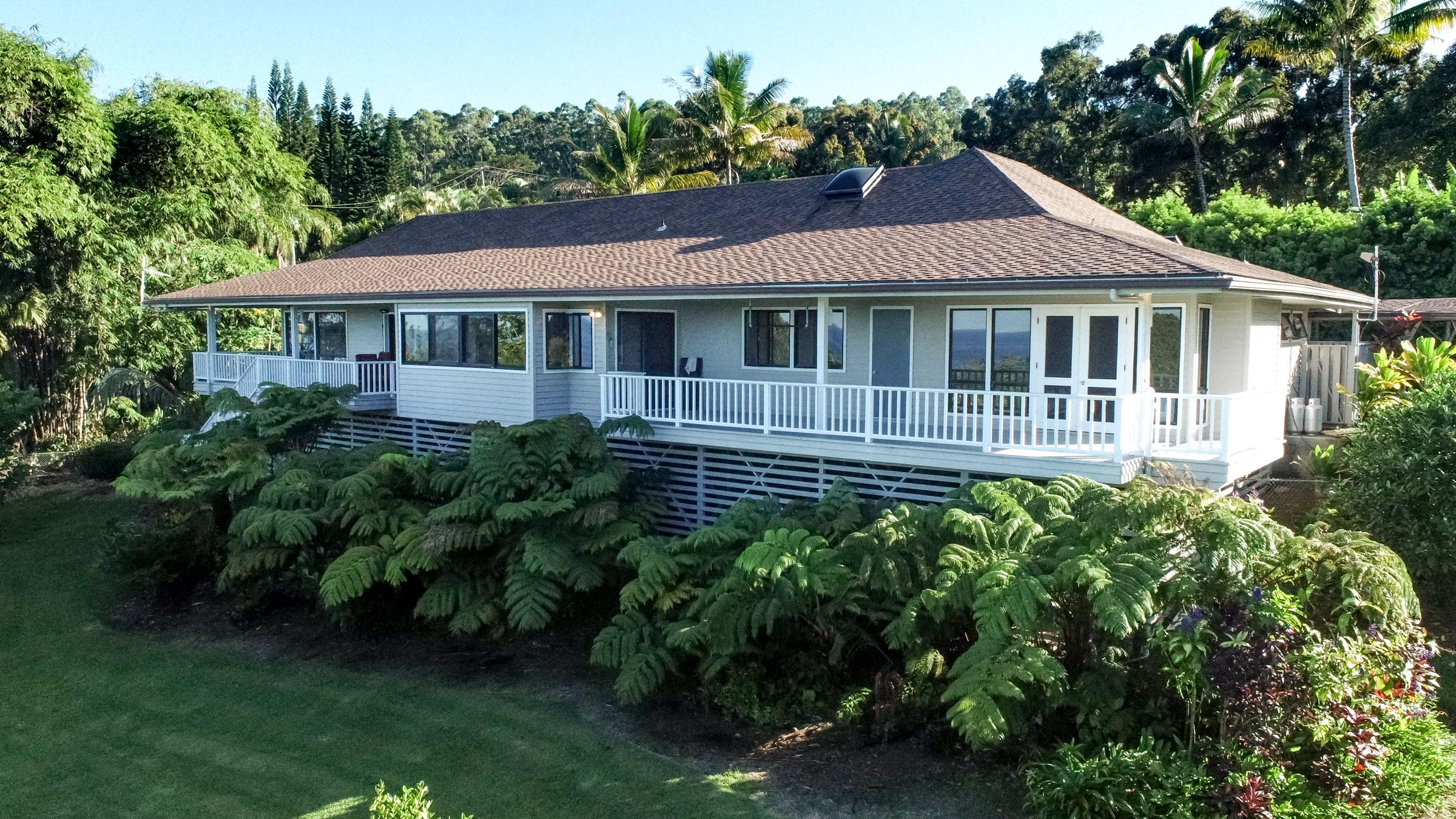 Beautiful landscaping surrounds this lovely one level home in Ninole.