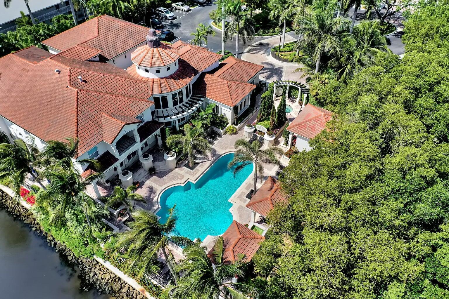 an aerial view of a house with a yard and garden