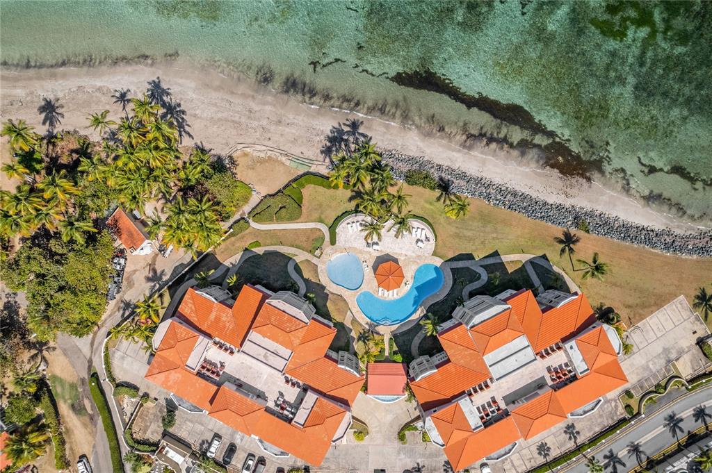 an aerial view of a house with a swimming pool