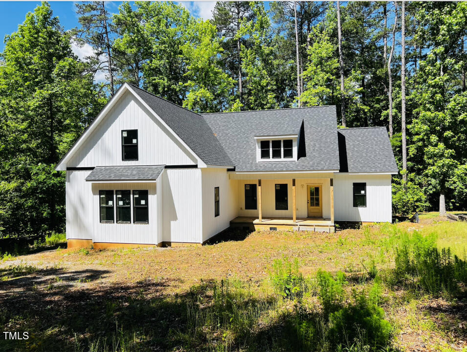 a house with trees in the background