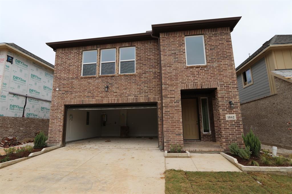 a brick house with a large windows