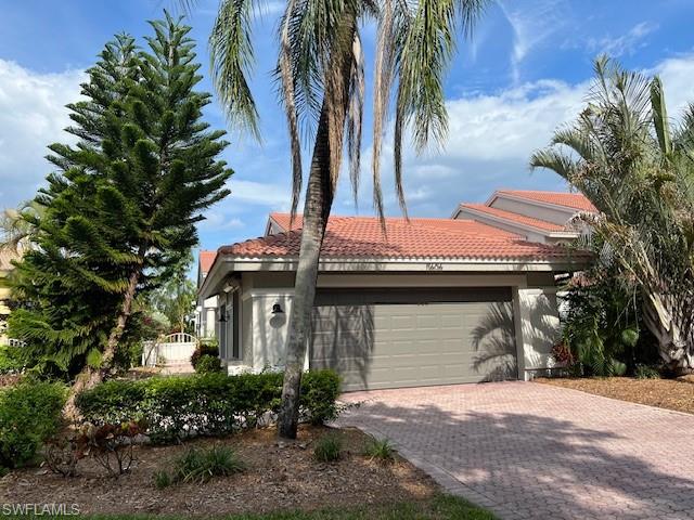 View of property exterior with a garage