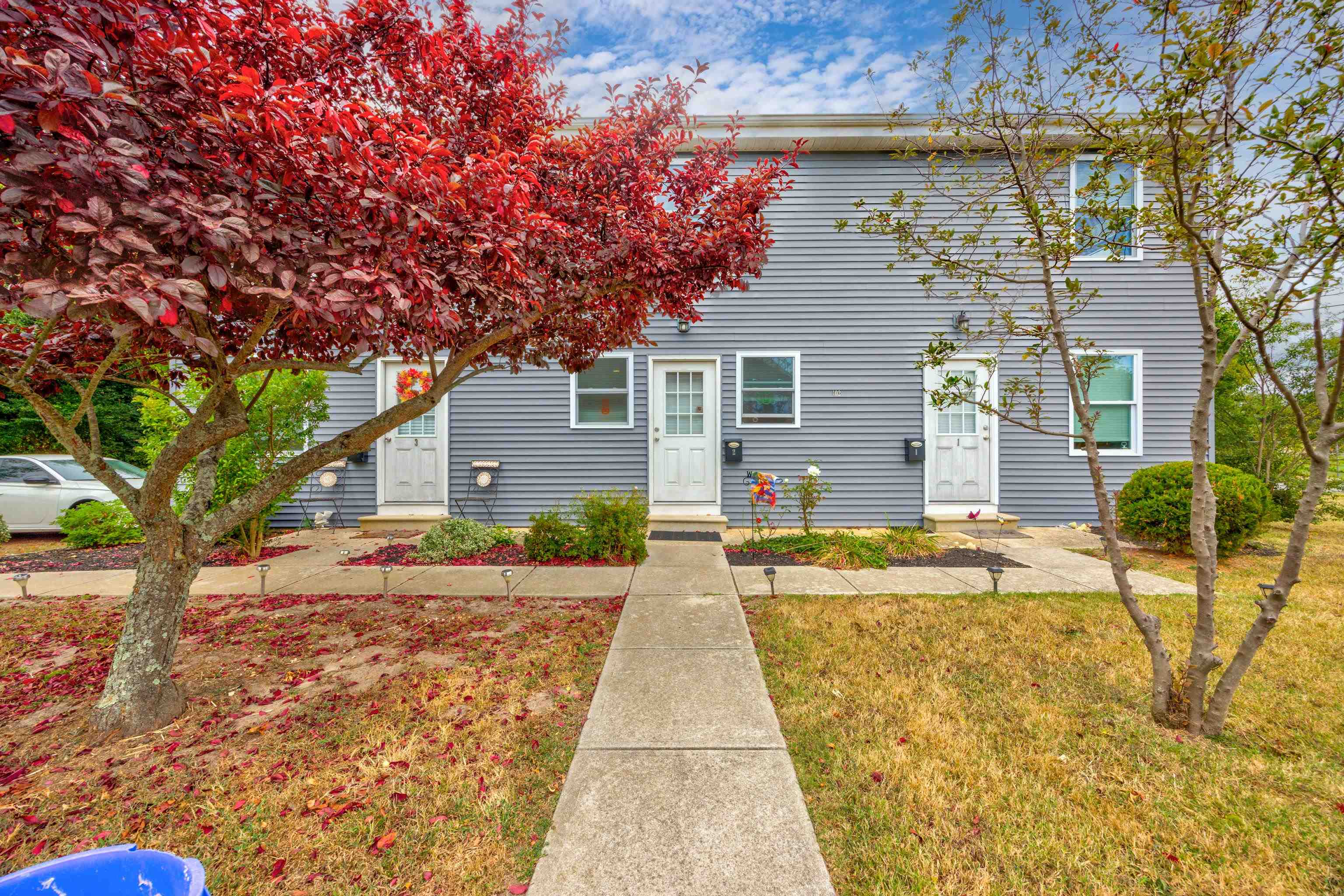 a front view of a house with garden