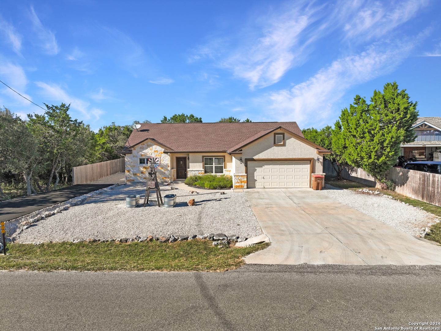 a view of house with outdoor space and garden