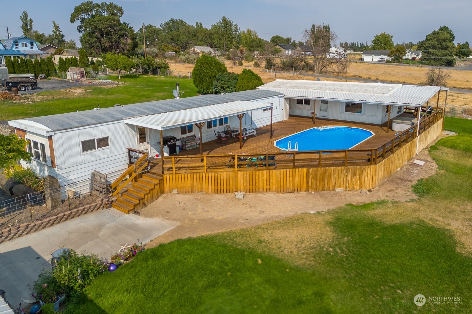 an aerial view of a house with a big yard