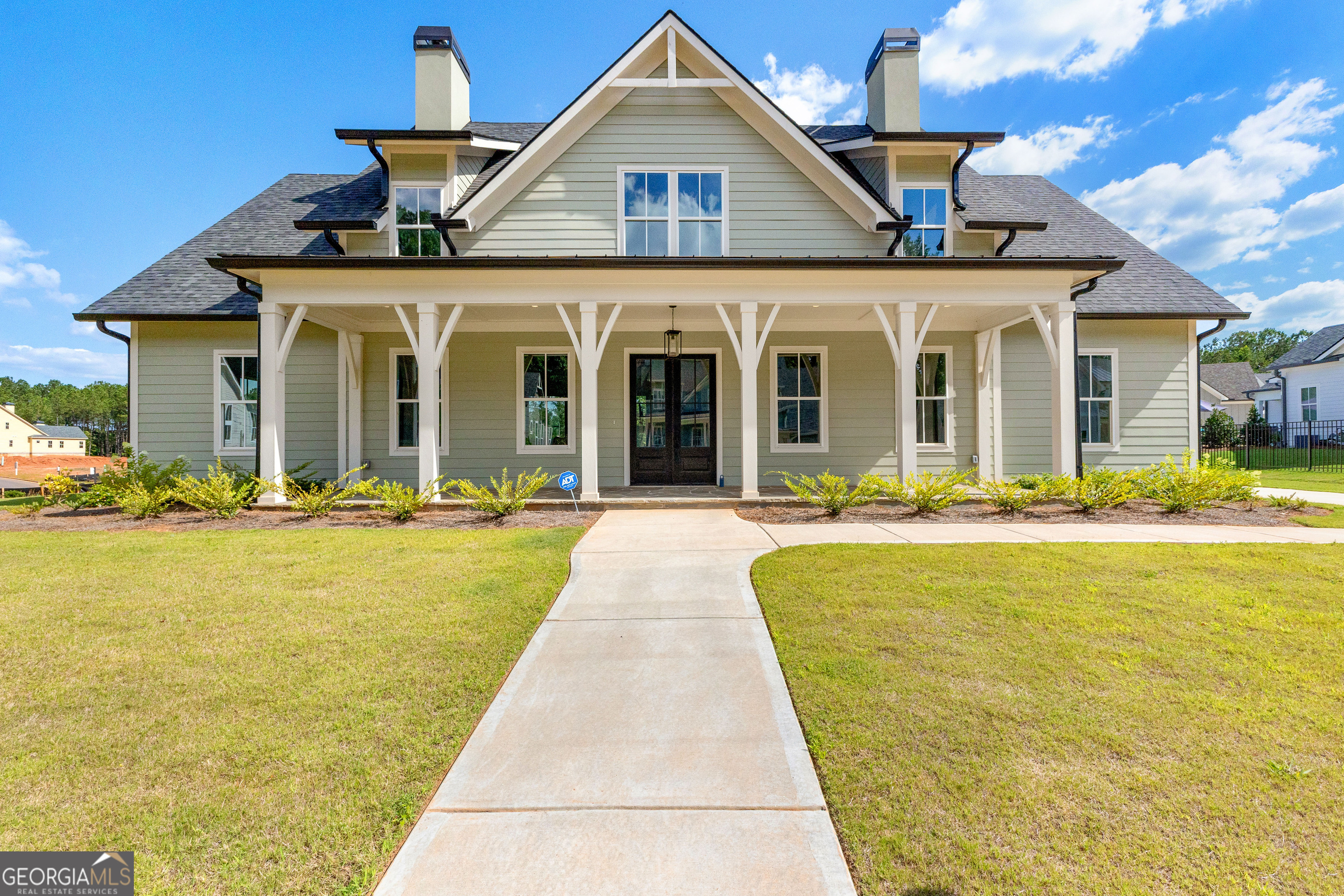 a front view of a house with swimming pool