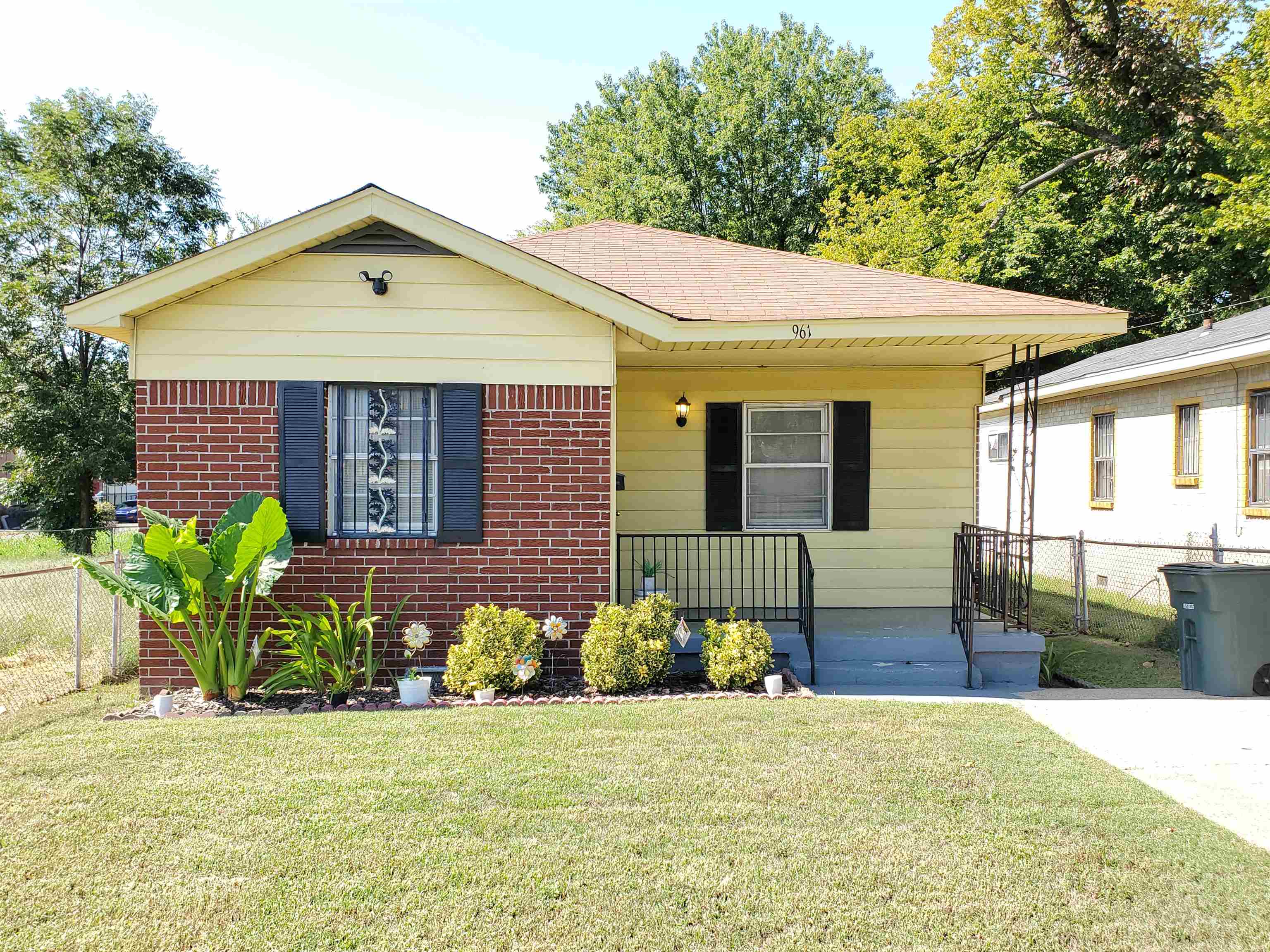 Bungalow-style house with a front yard