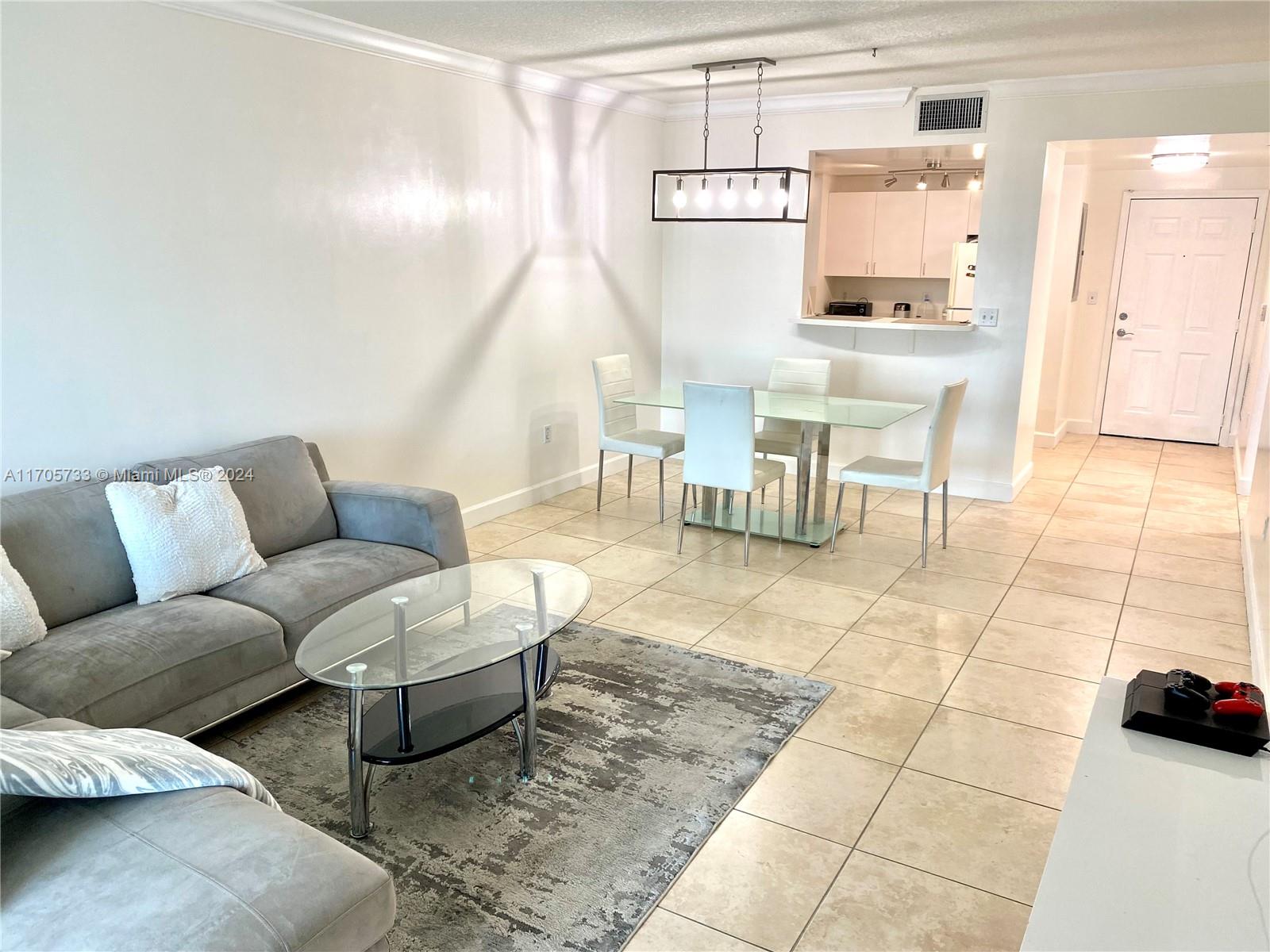 a living room with furniture and a table