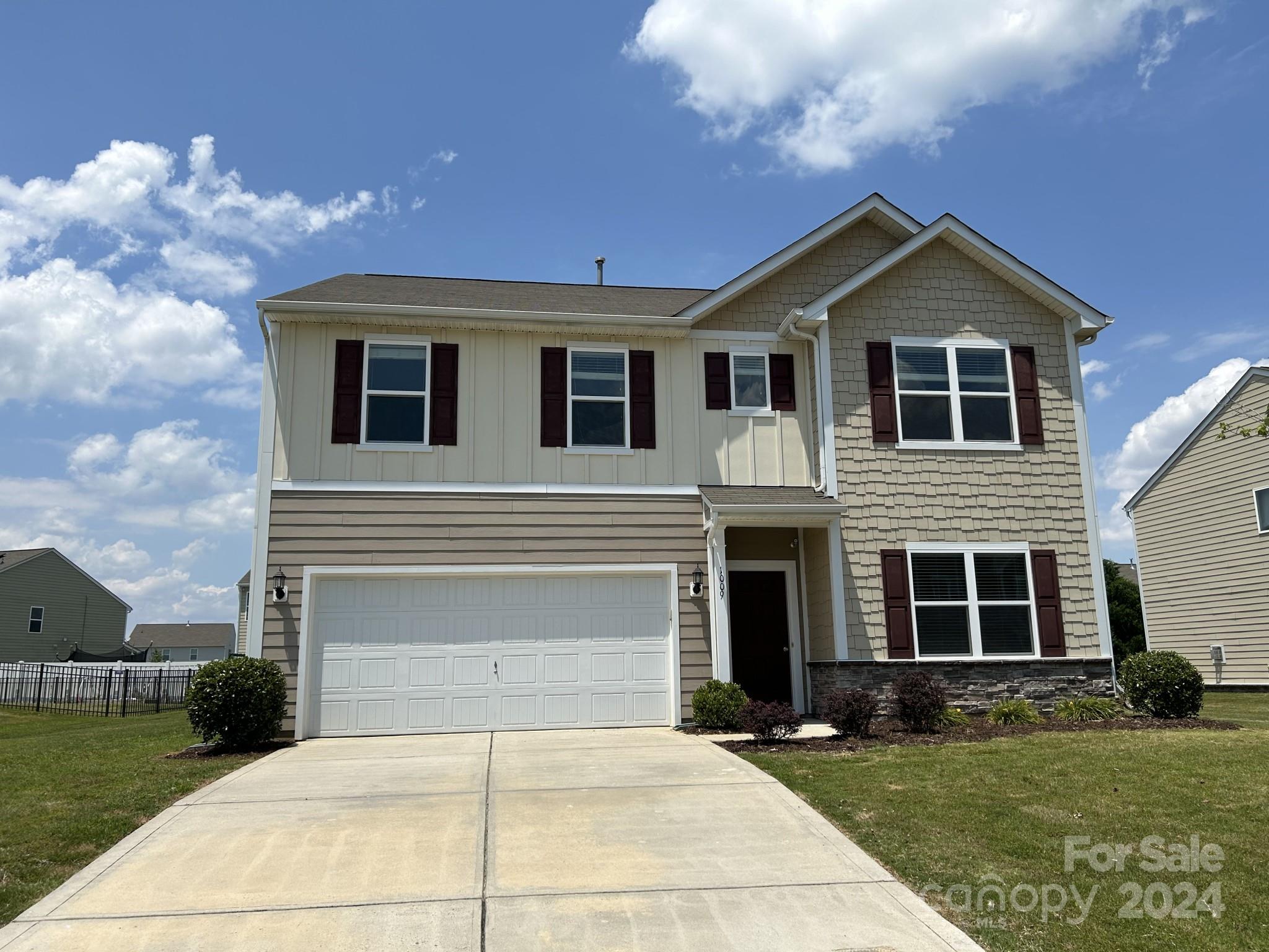 a front view of a house with a yard