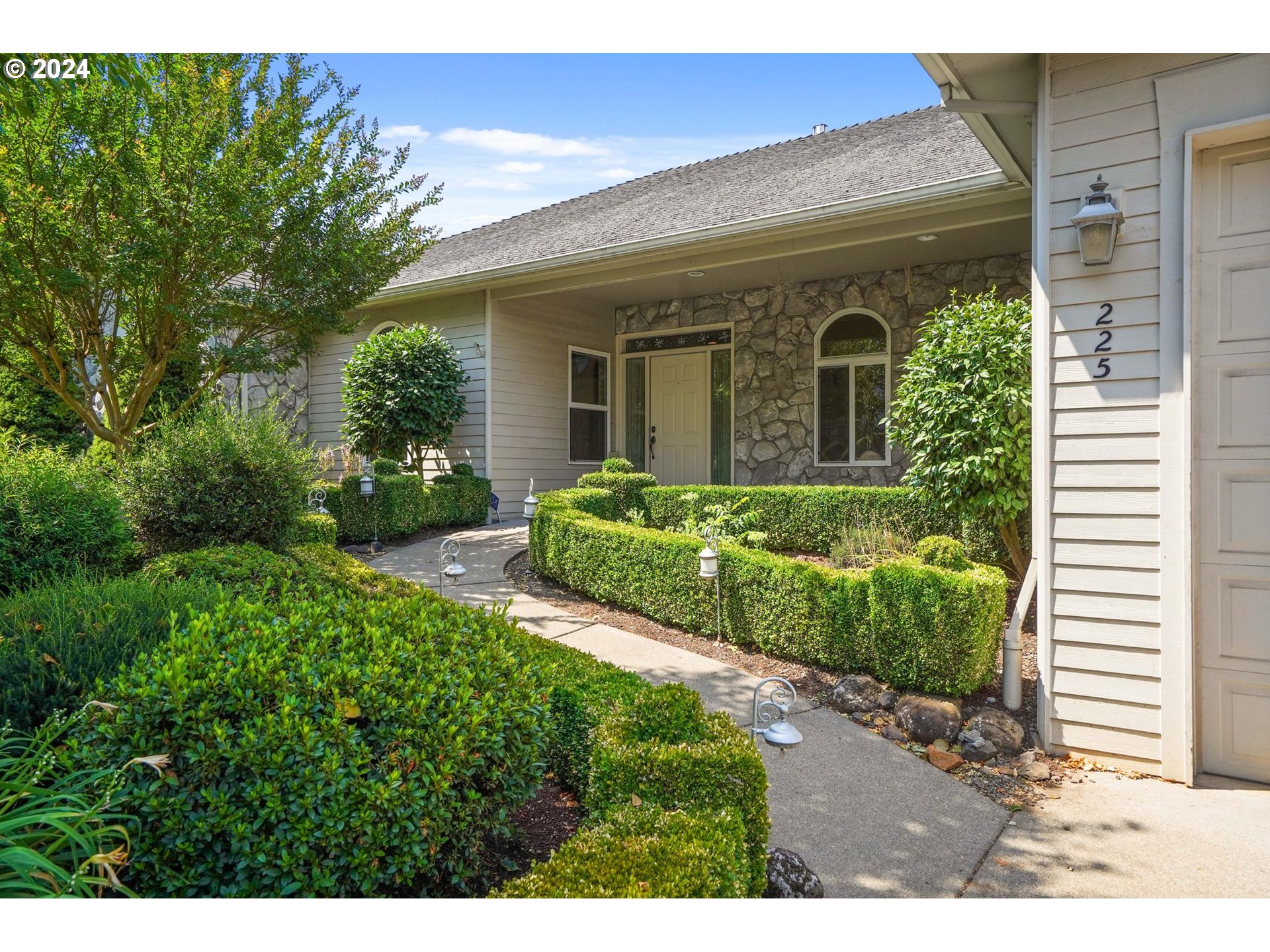 a front view of a house with a yard