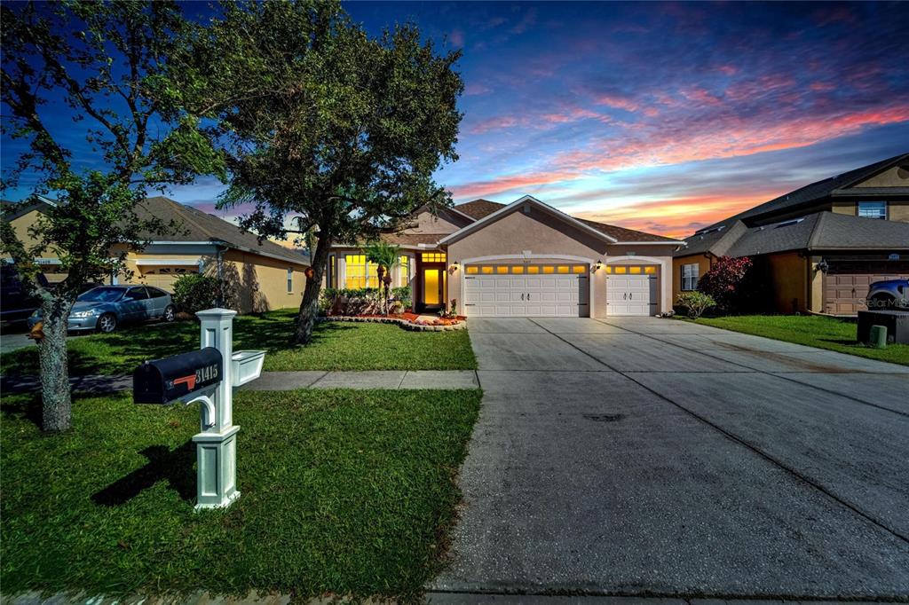 a front view of a house with a yard