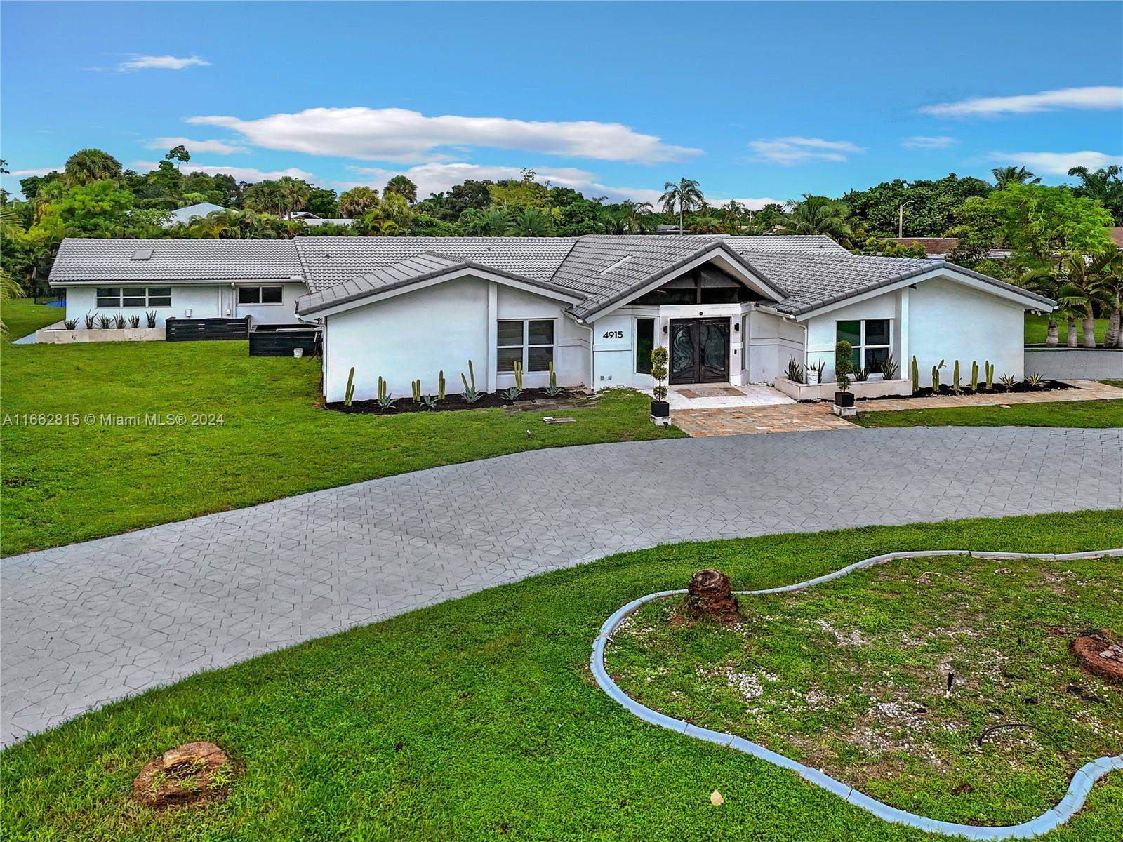 front view of a house with a yard