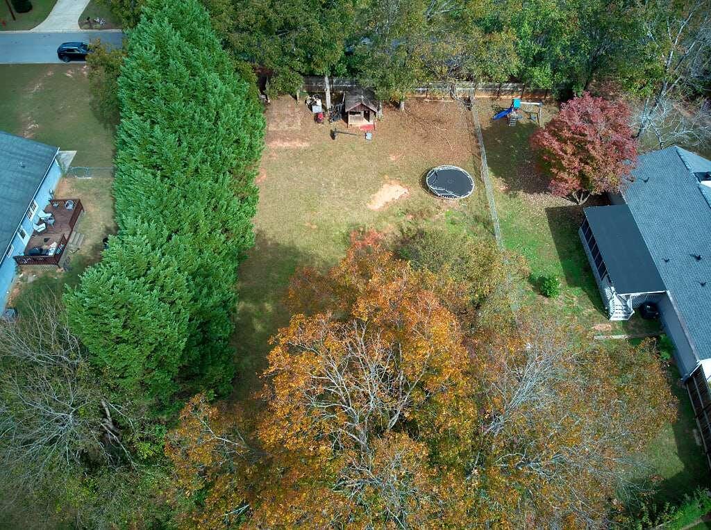 an aerial view of residential house with outdoor space