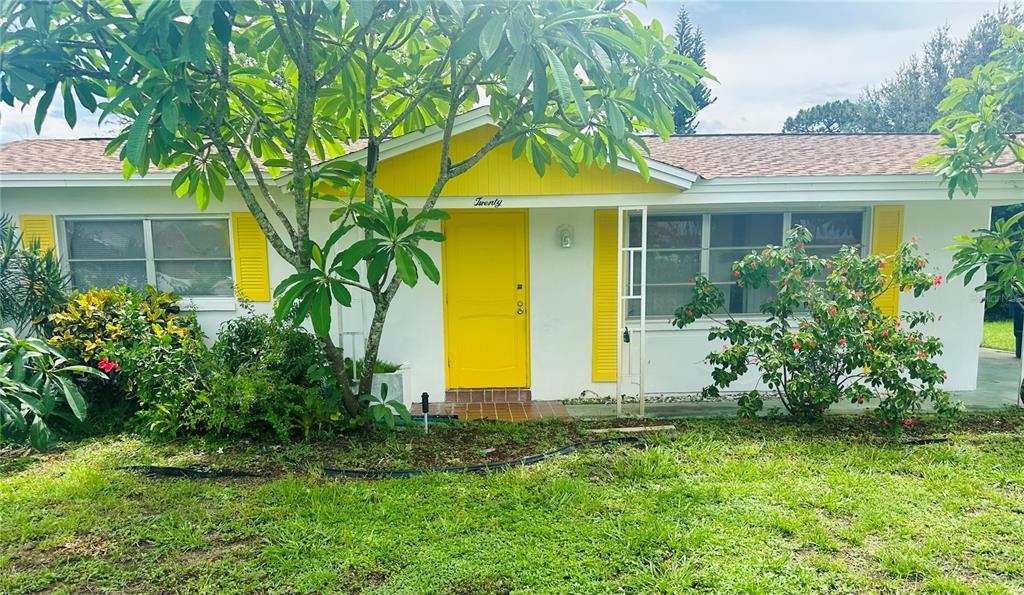 front view of a house with a yard