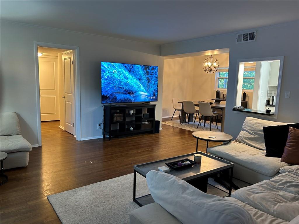 a living room with fireplace furniture and a flat screen tv