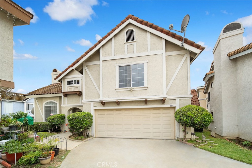 a view of a house with a yard and plants