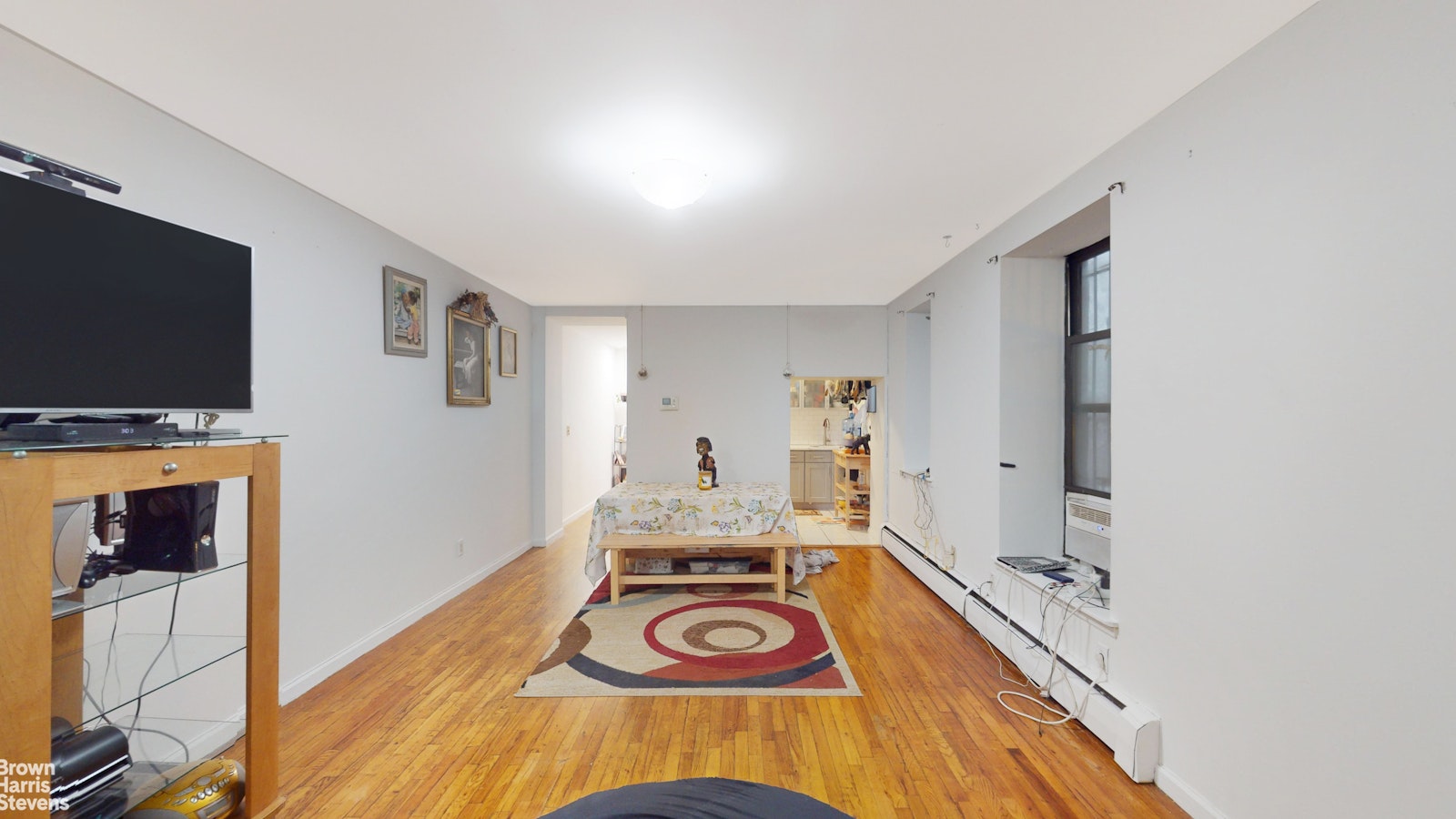 a view of livingroom with furniture and flat screen tv